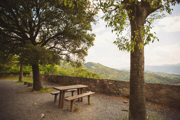 Empty picnic table and chairs in the mountains on a beautiful viewpoint. picnic table at the european mountains. amazing and beautiful place with beautiful view to stay.
