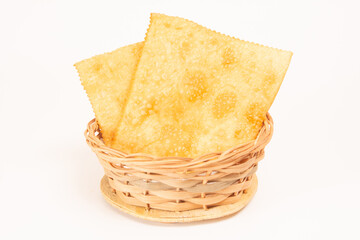 Pastel de Feira crocante brasileira traditional pastry fried street food basket isolated front view
