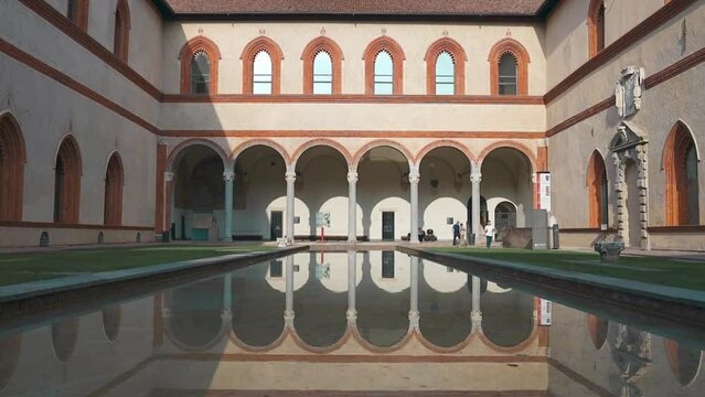 Medieval building with reflection on the water, Castello Sforzesco (Milan, Italy). High quality FullHD footage