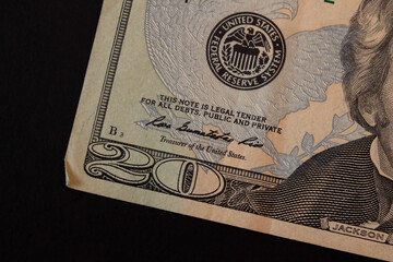 20 dollar bill on black background. Closeup photo.