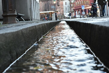  Urban Street Scene with Water Channel and Pedestrians - 740037066