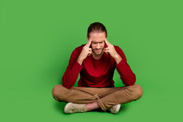 Full size photo minded pensive guy wear red shirt brown trousers sit on floor think solution of...