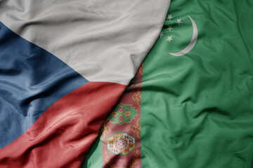 big waving national colorful flag of turkmenistan and national flag of czech republic.