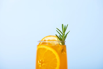 Closeup Glass of 100% Orange juice with orange slices fruits. Summer sea vacation and travel concept. Exotic summer drinks.