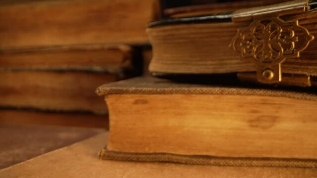 Macro view of saved medieval books with ancient writings. Religious literature, archival manuscripts, rare collection tomes, artifacts