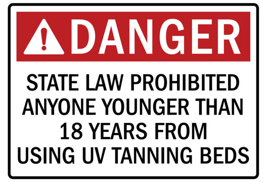 Ultraviolet warning sign and labels state law prohibited anyone younger than 18 years from using UV tanning beds