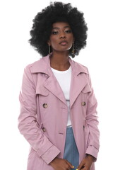 Beautiful young woman in a pink coat on a white background.