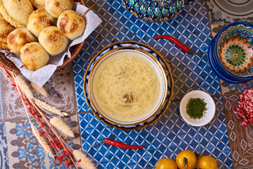 noodle soup with chicken broth on an oriental table, background