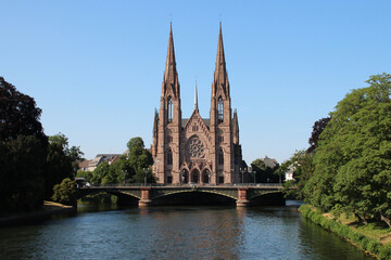protestant church (saint-paul) and ill river in strasbourg in alsace in france 