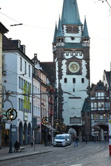 Historic City Gate Tower and Street Decorated with Lights in Freiburg, Germany - 740049217