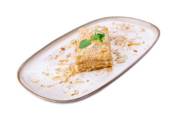 Napoleon Cake with almond on a white plate