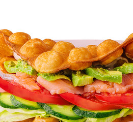 Belgian waffles with salmon, avocado and salad close up