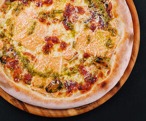 pizza with salmon and mussels top view