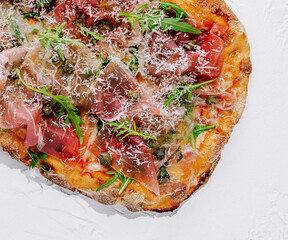 square pizza with prosciutto and arugula