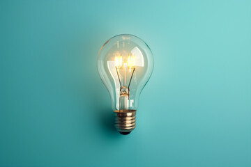 Light bulb on pastel blue background. concept idea - obrazy, fototapety, plakaty