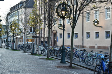  Cobblestone Pavement with Parked Bicycles in Freiburg, Germany - 740054267