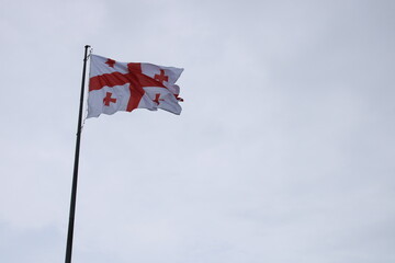 Georgian flag waving in the sky
