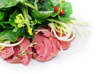 Warm baked duck salad with a mixture of salad leaves