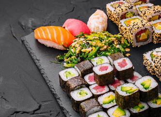 Sushi set on black stone background