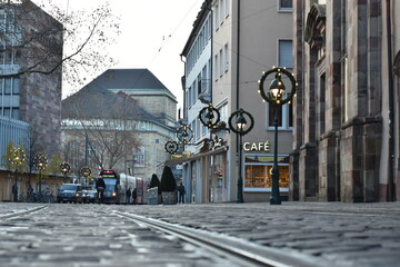  City Tramway and Bicycle Parking by Cobblestone Street with Cafe in Germany - 740059826