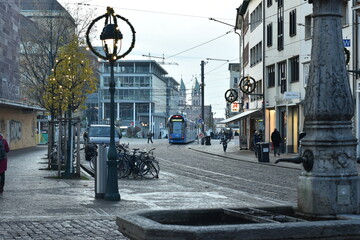  City Tramway and Bicycle Parking by Cobblestone Street with Cafe in Germany - 740059871
