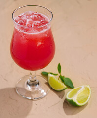 Cold summer strawberry cocktail with lime