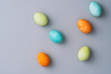 Hand painted colorful easter eggs on grey background