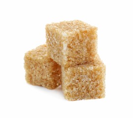 Three brown sugar cubes isolated on white
