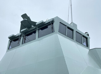Detail of a ship control tower in a port. Pilot cabin with windows on a boat. Measuring instruments on a vessel.