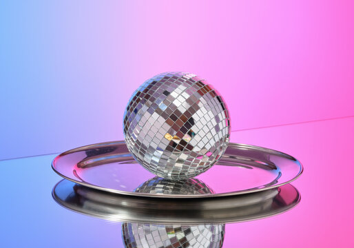 Night club party and disco ball on a tray. Decorative and stylish composition.