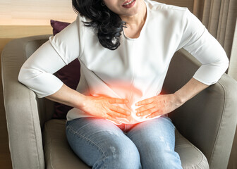 Abdominal pain in woman with stomachache illness from menstruation cramps, stomach cancer,...
