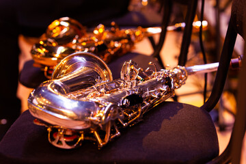  Saxophone lying on a chair on stage close-up - 740087662