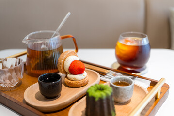 Strawberry dessert with coffee and tea in cafe