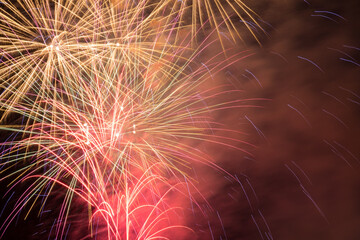 Outbreaks of fireworks in the night sky