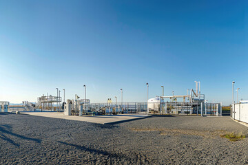 Fototapeta na wymiar A panoramic view of a green hydrogen production facility against a clear sky