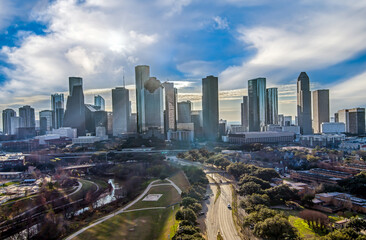 Naklejka na ściany i meble Aerial view of the Houston Texas Downtown cityscape with tall skyscrapers in early morning during winter.