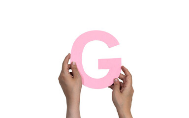 closeup hand holding paper letter G isolated on white