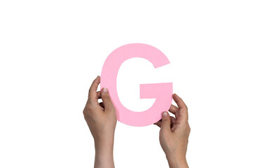 closeup hand holding paper letter G isolated on white