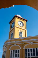 Iconic yellow clock tower in Chino-Portuguese style in Phuket old town