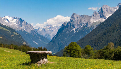 Fototapeta na wymiar Bergstifel in front of mountain landscape in the European Alps