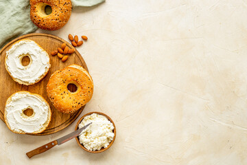 Set of fresh bread bagels with cheese cream. Healthy breakfast background