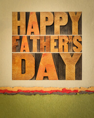 happy father's day - a word abstract in vintage letterpress wood type on art paper, greeting card