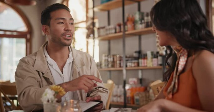 Menu, dating and couple speaking in restaurant together for love, romance or anniversary celebration. Fine dining, smile or chatting with man and woman at romantic dinner for valentines day date