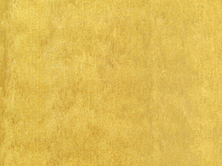 gold stain on grunge concrete floor, matt and rough surface of golden paint mottled