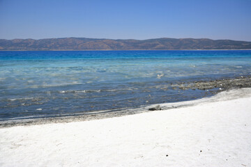 white sand and blue water on the beach copy space 