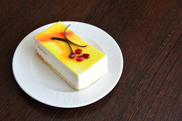 slice of lemon cheesecake on white saucer copy space 