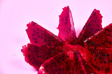 Red dragon fruit Set with appetizing serving on pink background. Top view