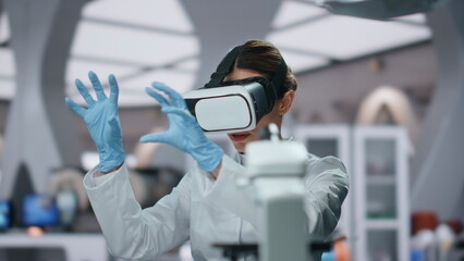 Virtual headset bioengineer researching augmented reality in lab close up. 