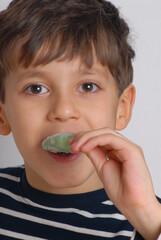 Little kid eating green popsicle - 740125211