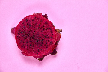 Red dragon fruit Set with appetizing serving on pink background. Top view